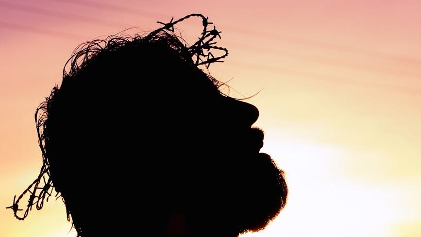 silhouette image of person praying